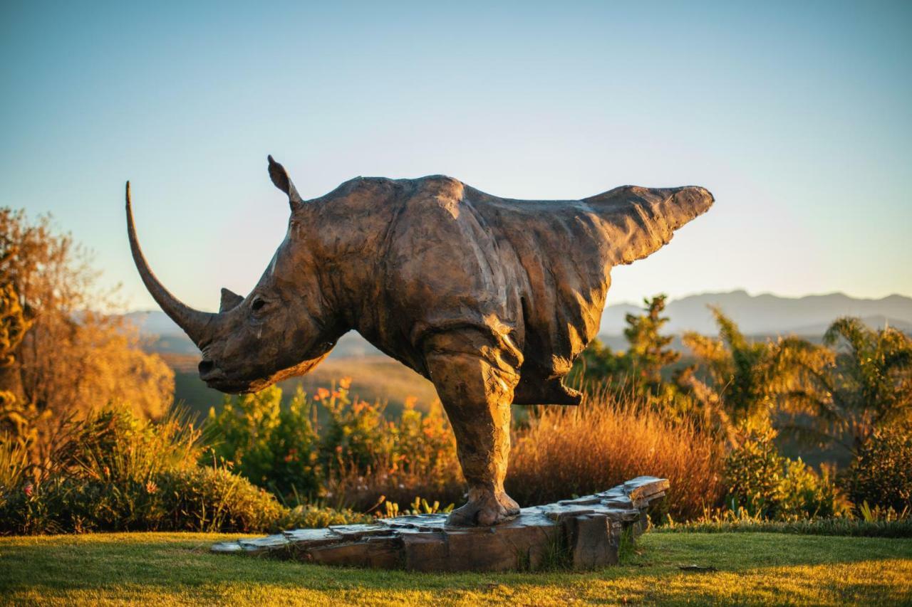 Sky Villa Boutique Hotel By Raw Africa Collection Plettenberg Bay Eksteriør bilde The sculpture of a white rhinoceros at the entrance of the park